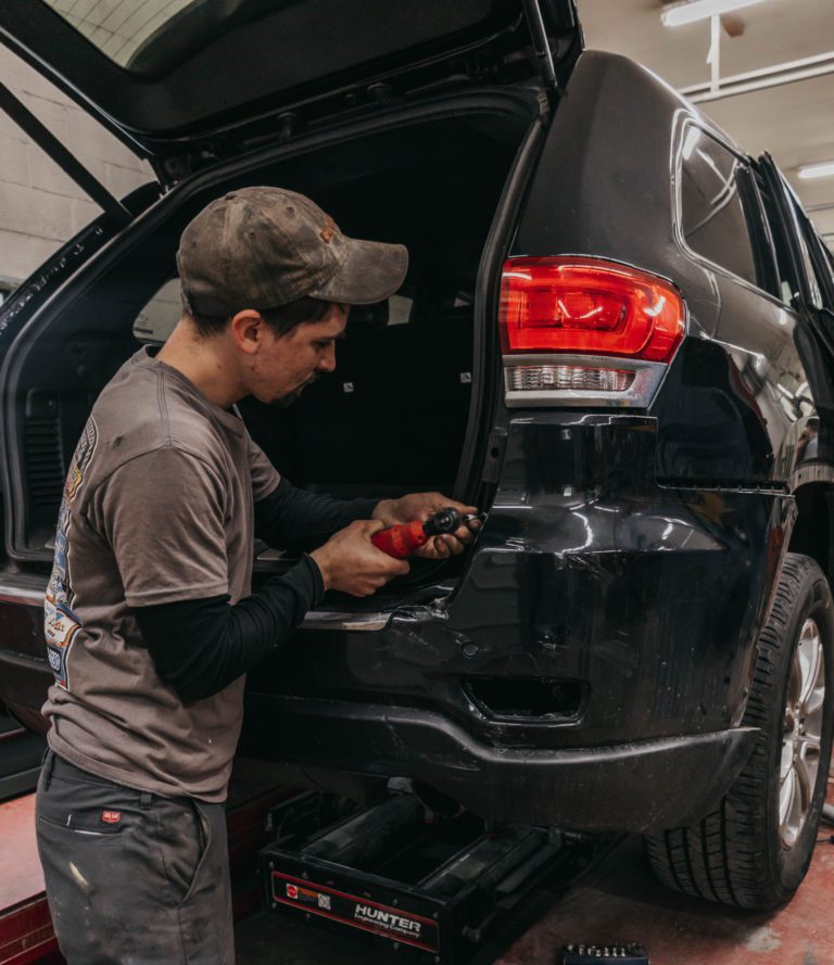 black vehicle being repaired